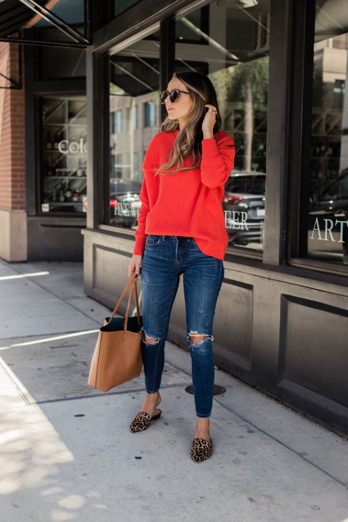 a bold red sweater and leopard loafer mules