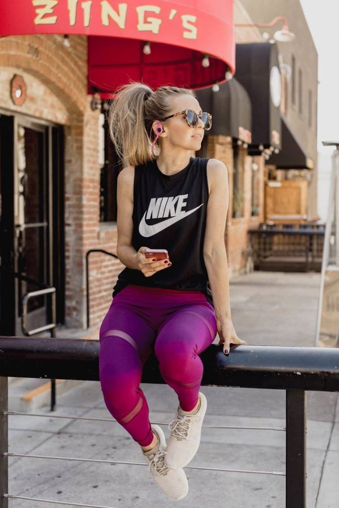 nike tank with old navy leggings and earbuds