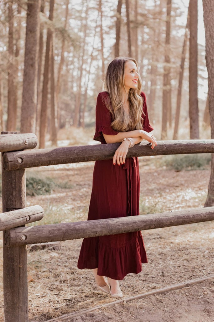 burgundy midi dress with a ruffle