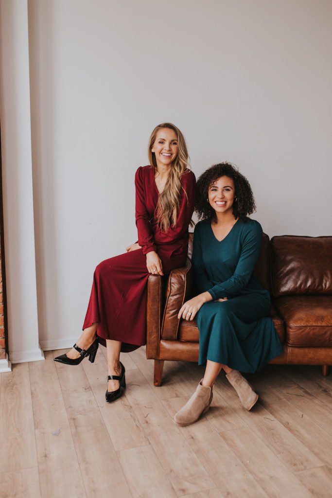 Girls on brown leather couch dark red midi dress teal midi dress