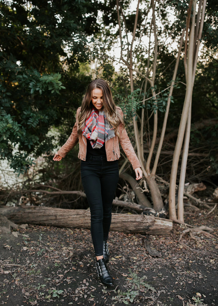 brown suede jacket and black jeans