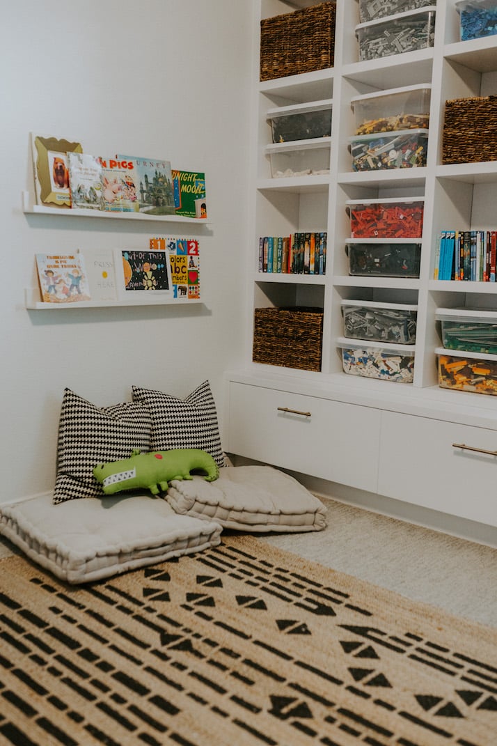 playroom floor pillows and floating bookshelves