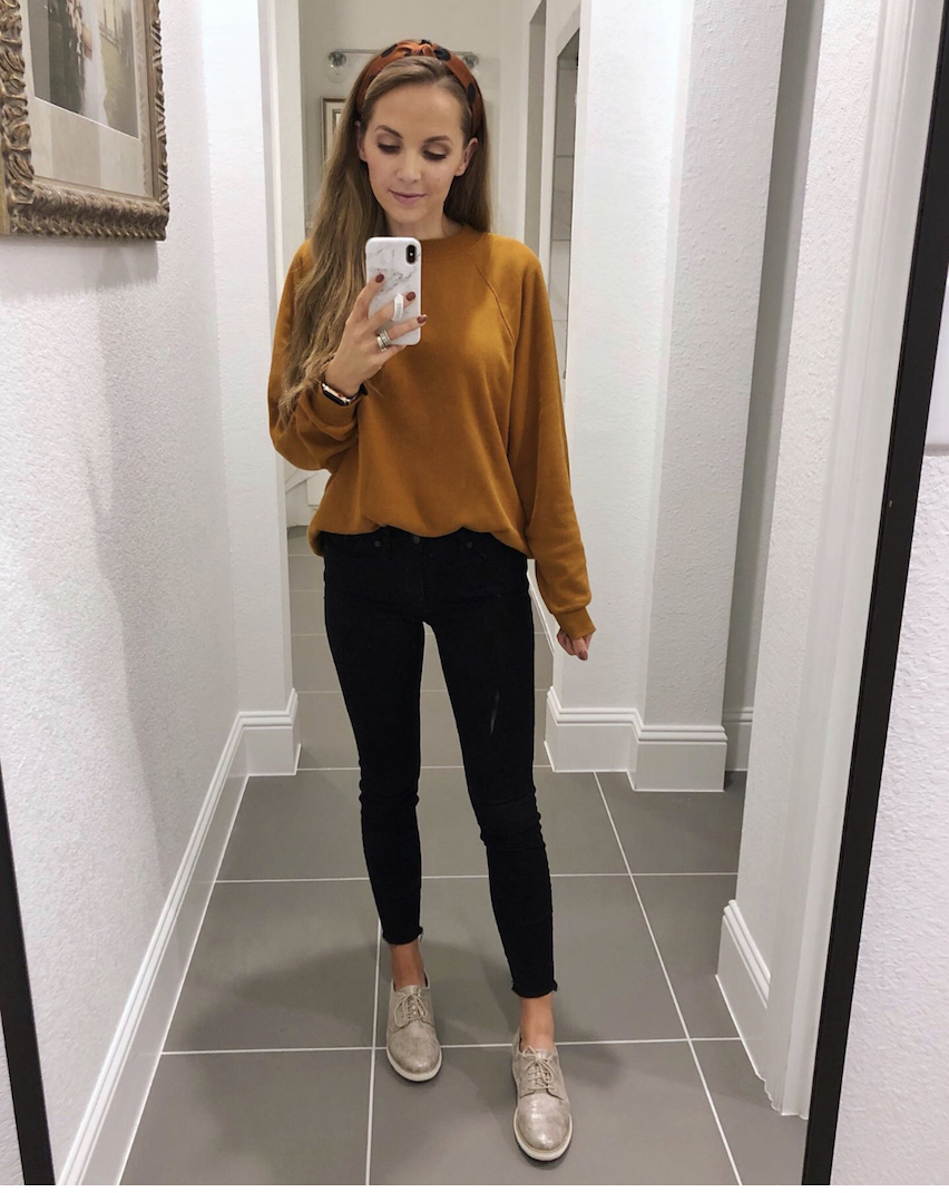 caramel sweatshirt and black jeans
