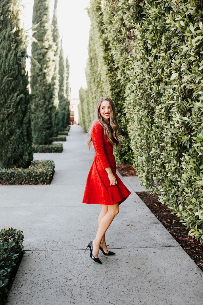 red fit and flare dress with black pumps