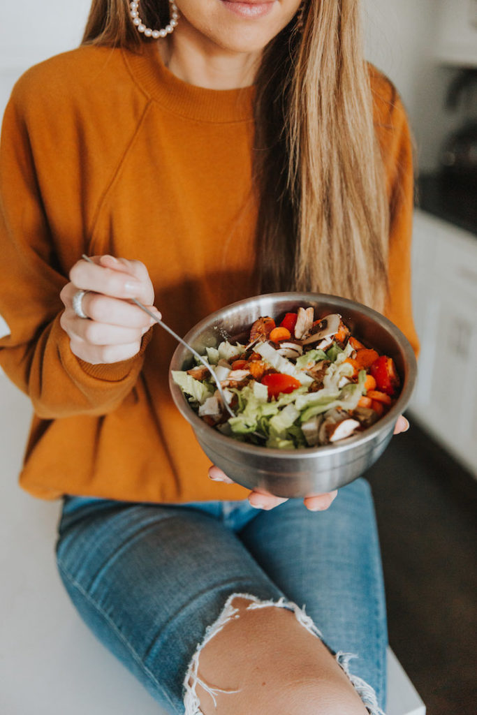 orange sweatshirt, green salad