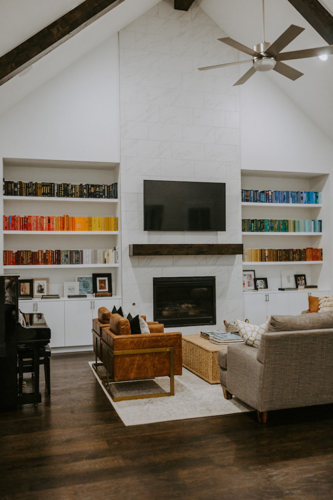 rainbow bookshelf and fireplace