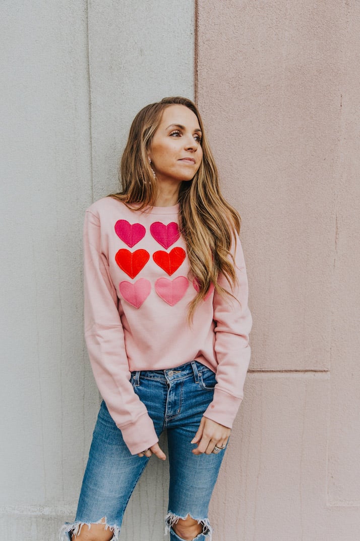 distressed jeans and valentine's day sweatshirt