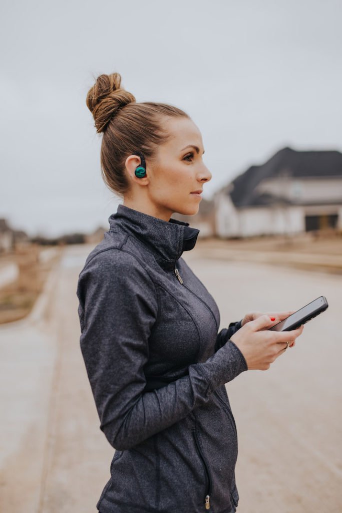 gray nike running jacket plantronics headphones