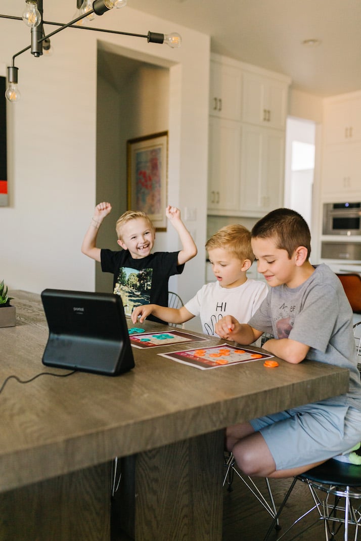 boys at kitchen table with facebook portal