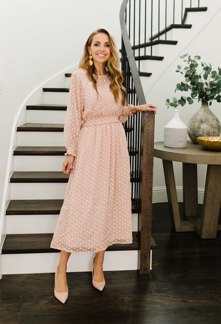 polka dot blush dress on the staircase