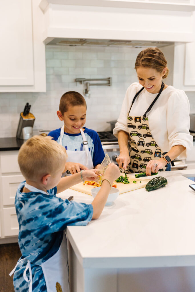 cooking with kids - chopping vegetables at the kitchen counter