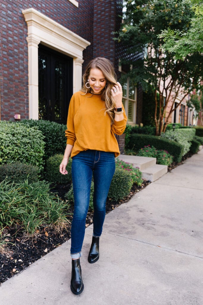 camel sweatshirt with pearl earrings